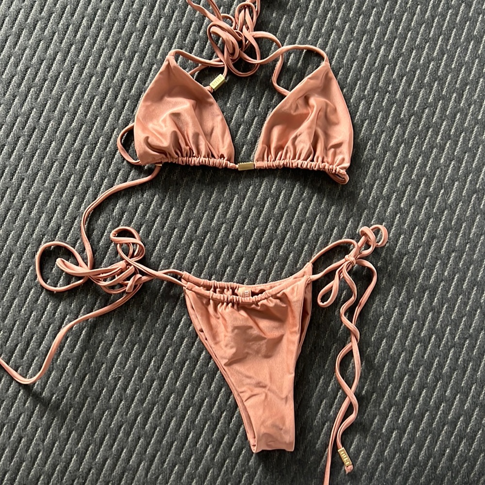 Pink shimmery Bikini by Nua swim.